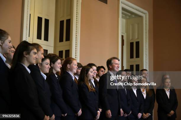 Judge Brett Kavanaugh poses for photographs with members of the Senate Page program at the U.S. Capitol July 11, 2018 in Washington, DC. Kavanaugh is...