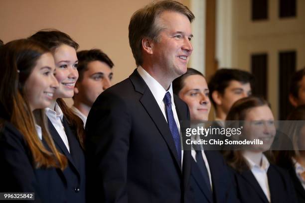 Judge Brett Kavanaugh poses for photographs with members of the Senate Page program at the U.S. Capitol July 11, 2018 in Washington, DC. Kavanaugh is...