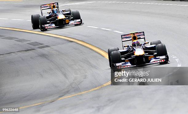Red Bull's Australian driver Mark Webber drives ahead of Red Bull's German driver Sebastian Vettel at the Monaco street circuit on May 16 during the...