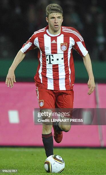 Bayern Munich's striker Thomas Mueller plays the ball during the DFB German Cup final football match Werder Bremen vs Bayern Munich in Berlin on May...