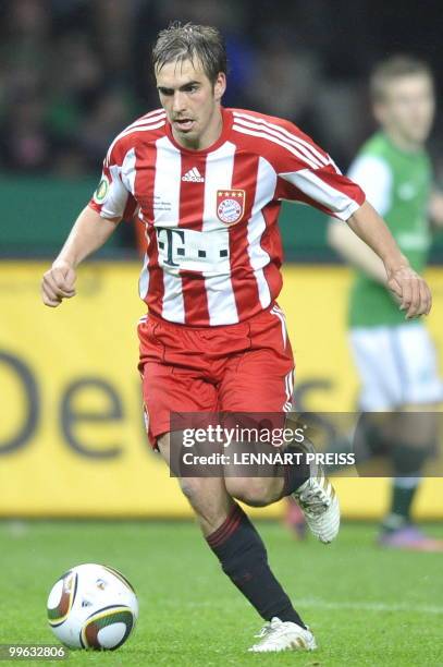 Bayern Munich's defender Philipp Lahm plays the ball during the DFB German Cup final football match Werder Bremen vs Bayern Munich in Berlin on May...