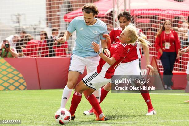 Diego Forlan and Marina Fedorova in action during the Legends Football Match in "The park of Soccer and rest" at Red Square on July 11, 2018 in...