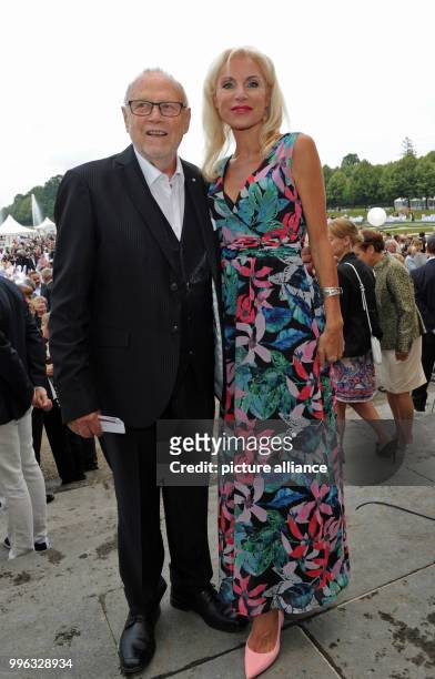 July 2018, Germany, Munich: The director Joseph Vilsmaier and his partner Birgit Muth attend the summer reception of the Bavarian state parliament at...