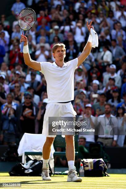 Kevin Anderson of South Africa celebrates winning match point against Roger Federer of Switzerland during their Men's Singles Quarter-Finals match on...