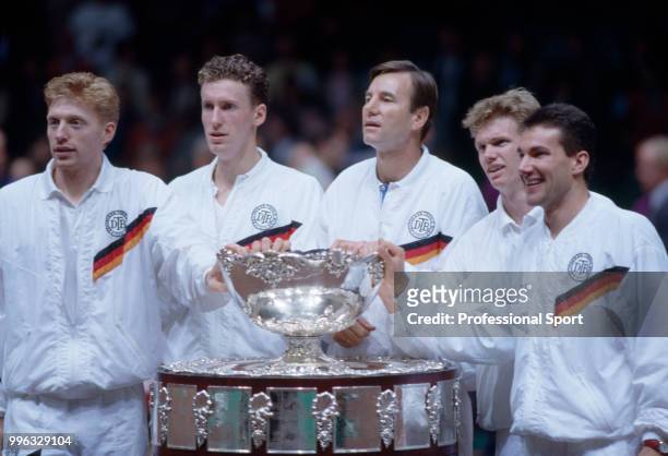 The West German Davis Cup team Boris Becker, Patrik Kuhnen, Niki Pilic , Eric Jelen and Carl-Uwe Steeb pose with the trophy after defeating Sweden in...