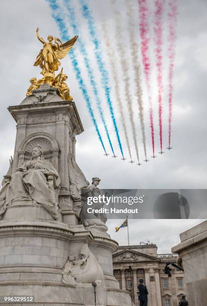 In this handout image provided by the Ministry of Defence, the Red Arrows perform for the RAF100 flypast over London during RAF 100 celebrations on...