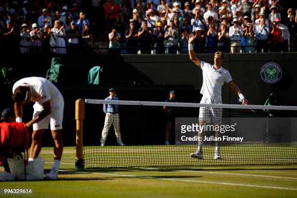 Kevin Anderson of South Africa celebrates winning match point against Roger Federer of Switzerland during their Men's Singles Quarter-Finals match on...