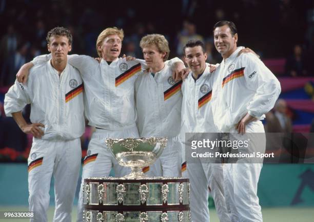 The West German Davis Cup team Patrik Kuhnen, Boris Becker, Eric Jelen, Carl-Uwe Steeb and Niki Pilic pose with the trophy after defeating Sweden in...