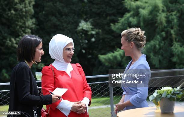 First Lady of Turkey Emine Erdogan , chats with Partner of Slovenia's Prime Minister Mojca Stropnik during a visit of the spouses of NATO leaders in...