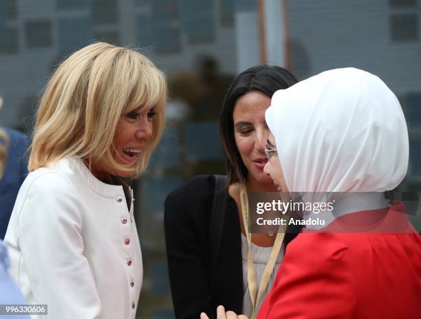 First Lady of Turkey Emine Erdogan , chats with First Lady of France Brigitte Macron during a visit of the spouses of NATO leaders in Walloon...