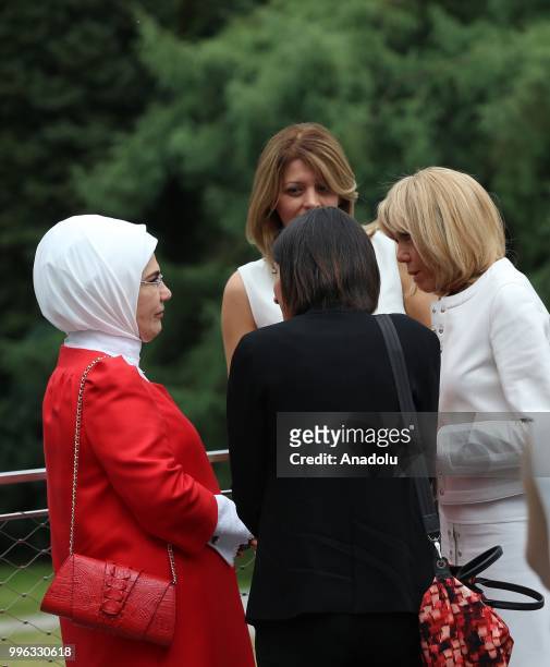 First Lady of Turkey Emine Erdogan , chats with First Lady of France Brigitte Macron and Partner of Bulgaria's President Desislava Radeva during a...
