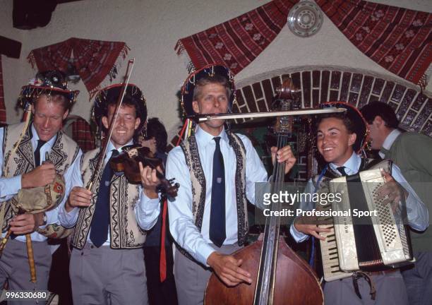 British tennis players Stuart Bale, Jeremy Bates and Andrew Castle playing in a traditional Romanian band at an event during the Davis Cup tie...