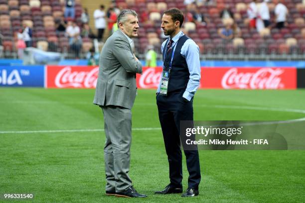 Gareth Southgate, Manager of England speaks with Former Croatia player, Davor Suker during a pitch inspection prior to the 2018 FIFA World Cup Russia...