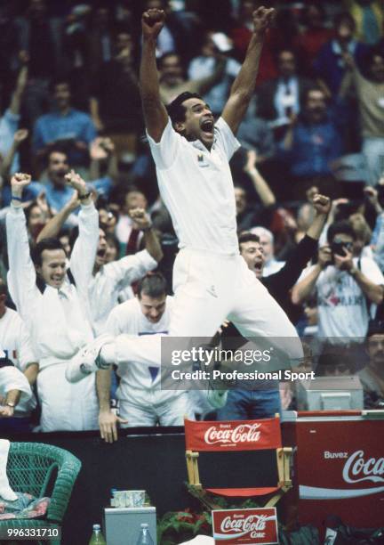 The French Davis Cup team captain Yannick Noah celebrates after his team defeat the USA in the Final of the Davis Cup at the Palais des Sports de...