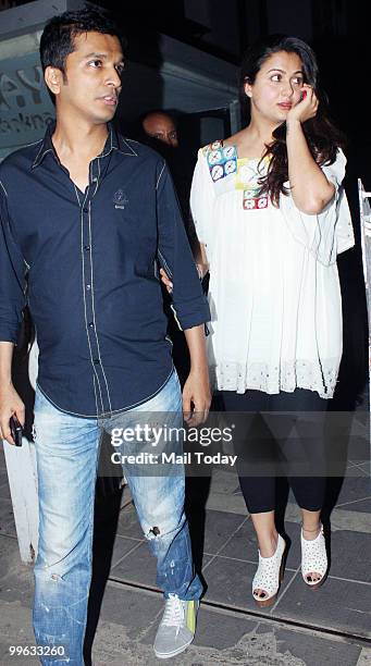 Vikram Phadnis and Amrita Arora after a party in Mumbai on May 13, 2010.