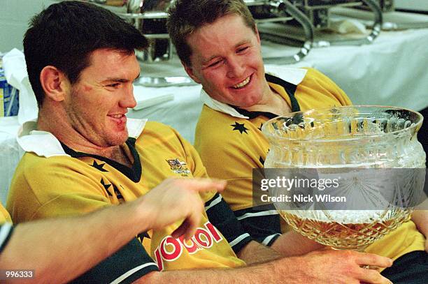 Daniel Herbert and Elton Flatley of Australia with the Tom Richards Cup after the third and final Test Match played between the British and Irish...