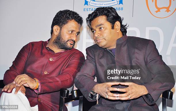 Bollywood sound designer Resul Pookutty with A.R.Rahman at the launch Pookutty's autobiography 'Sabdatharapadham' in Mumbai on May 13, 2010.
