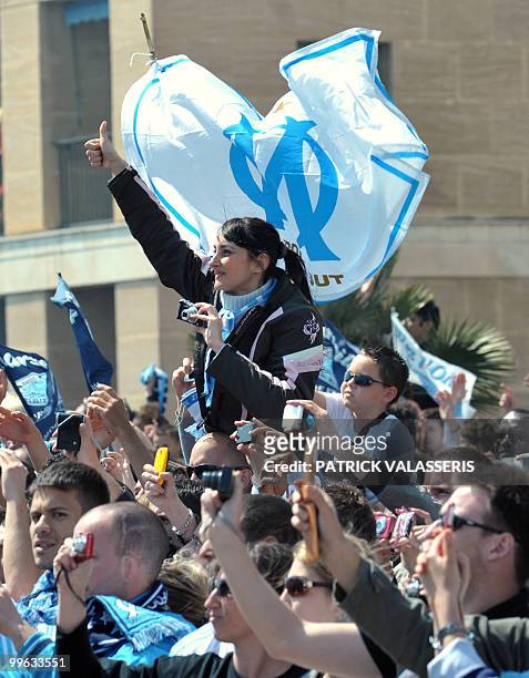 Olympique de Marseille supporters picture with cameras and cell phones olympique de Marseille's players as they parade in buses following the team's...