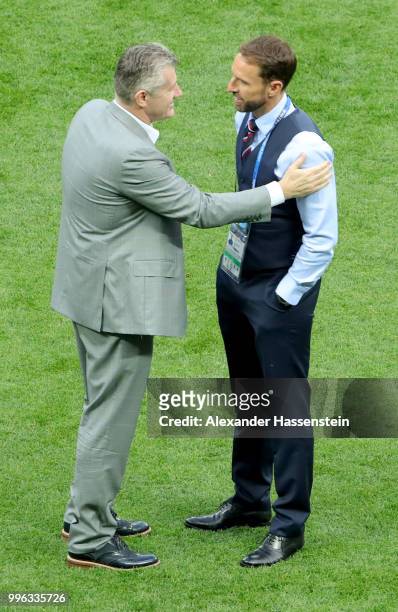 Gareth Southgate, Manager of England cheers former striker Davor Suker during a pitch inspection prior to the 2018 FIFA World Cup Russia Semi Final...