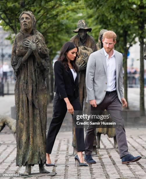 Prince Harry, Duke of Sussex and Meghan, Duchess of Sussex visit the Famine Memorial during their visit to Ireland on July 11, 2018 in Dublin,...