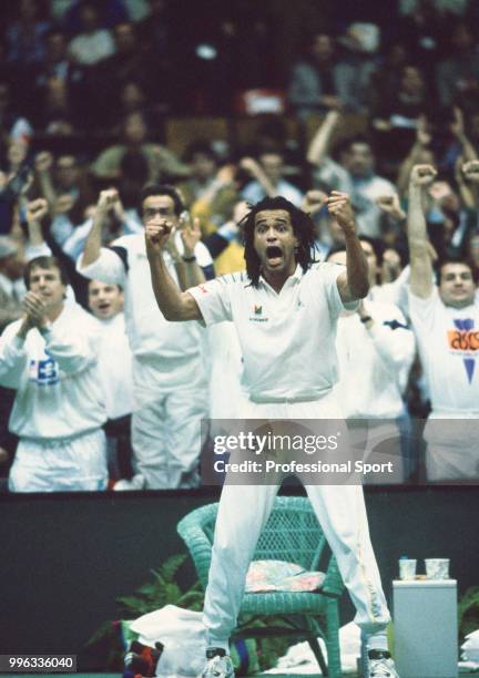 The French Davis Cup team captain Yannick Noah celebrates after his team defeat the USA in the Final of the Davis Cup at the Palais des Sports de...