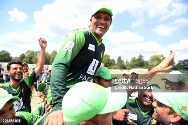 Sher Ali Afridi and the Pakistan players celebrate after winning the Vitality IT20 Physical Disability Tri-Series match between England and Pakistan...
