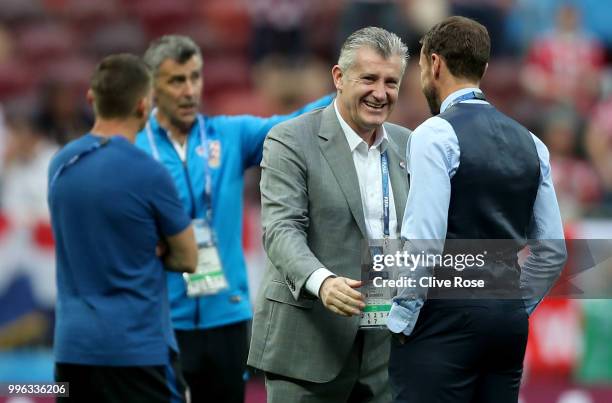 Gareth Southgate, Manager of England cheers former striker Davor Suker during a pitch inspection prior to the 2018 FIFA World Cup Russia Semi Final...