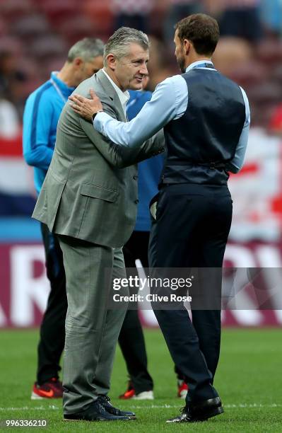 Gareth Southgate, Manager of England cheers former striker Davor Suker during a pitch inspection prior to the 2018 FIFA World Cup Russia Semi Final...