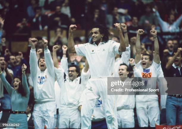 The French Davis Cup team captain Yannick Noah celebrates after his team defeat the USA in the Final of the Davis Cup at the Palais des Sports de...
