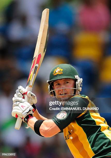 Australian captain Michael Clarke plays a shot during the Men's ICC World Twenty20 final match between Australia and England at the Kensington Oval...