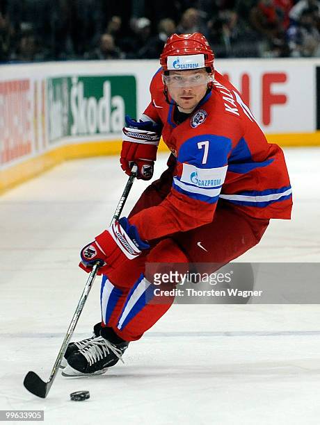 Dmitri Kalinin of Russia runs with the puck during the IIHF World Championship qualification round match between Russia and Germany at Lanxess Arena...