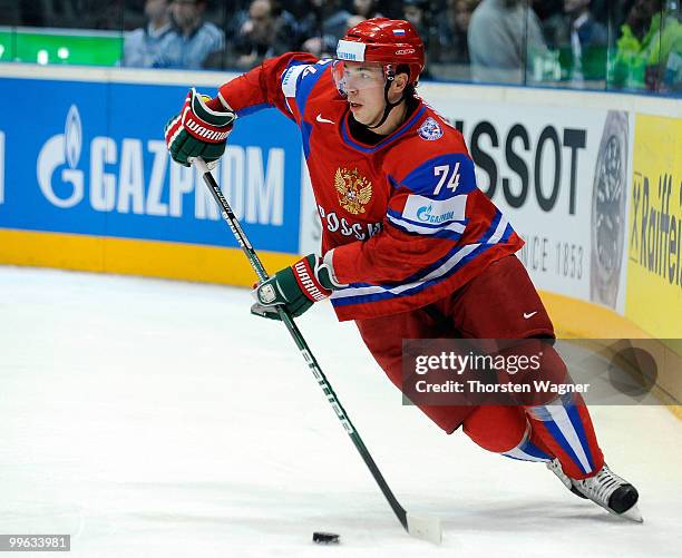 Alexei Emelin of Russia runs with the puck during the IIHF World Championship qualification round match between Russia and Germany at Lanxess Arena...