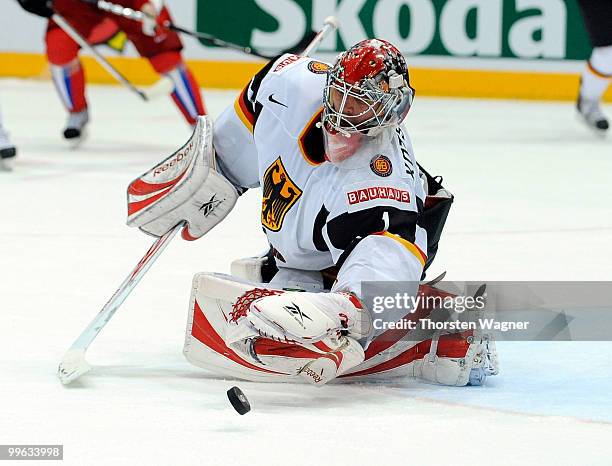 Goalkeeper Dimitri Kotschnew saves a puck during the IIHF World Championship qualification round match between Russia and Germany at Lanxess Arena on...