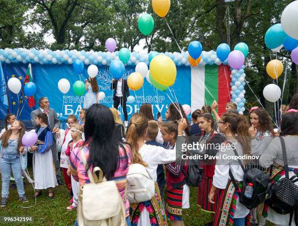 the leaders of the movement for rights and freedoms (ethnic turkish party) celebrating with children and other participants during the traditional national festivity in the neighborhood of baba kondu in the municipality of targovishte, bulgaria - baba stock pictures, royalty-free photos & images