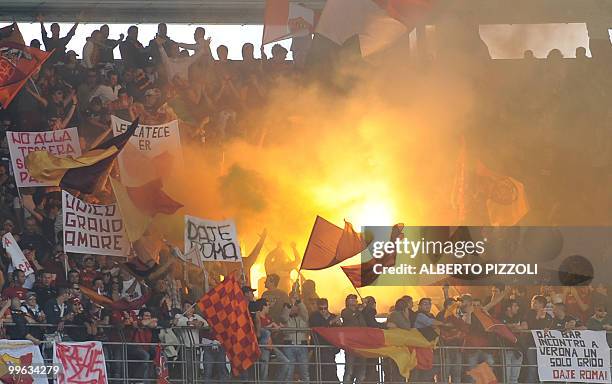 Roma's supporters wave banners during their team's Italian serie A football match against Chievo at Marc'Antonio Bentegodi stadium in Verona on May...