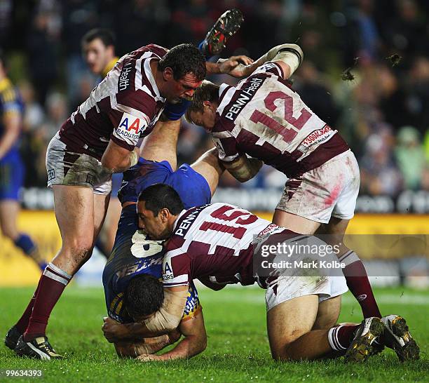 Nathan Cayless of the Eels is tackled during the round ten NRL match between the Manly Sea Eagles and the Parramatta Eels at Brookvale Oval on May...