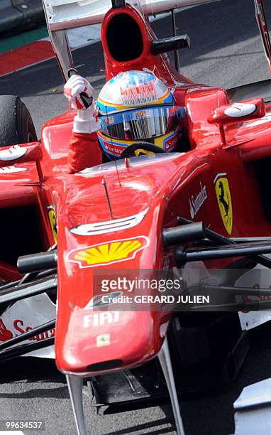 Ferrari's Brazilian driver Felipe Massa celebrates at the Monaco street circuit on May 16 after the Monaco Formula One Grand Prix. Red Bull's...