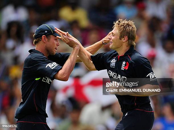 English bowler Luke Wright celebrates with Stuart Broad who caught the ball to dismiss Australian batsman Cameron White during the Men's ICC World...