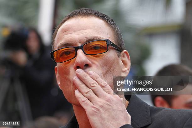 Belgian actor Jean-Claude Van Damme arrives for the screening of "You Will Meet a Tall Dark Stranger" presented out of competition at the 63rd Cannes...