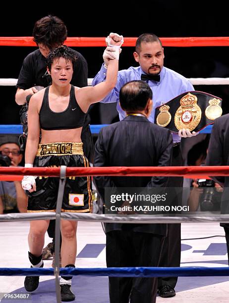 Women's super flyweight champion Tsunami Tenkai of Japan celebrates her second title defense against Kayoko Ebata of Japan after their title boxing...