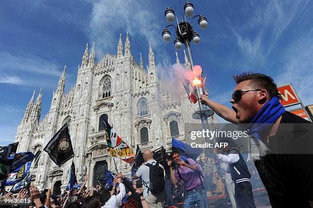 Inter Milan supporters celebrate at Piazza Duomo in Milan after Inter Milan won the Italia Serie A football title on May 16, 2010. Inter Milan...