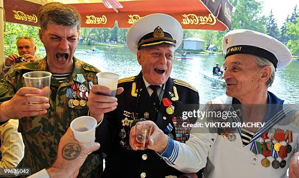 Russian WWII veterans toast while celebrating the 65th anniversary of Victory Day in Moscow on May 9, 2010. Chinese President Hu Jintao spoke out...