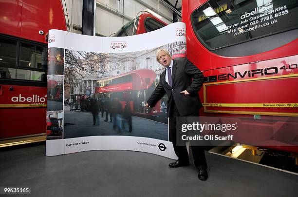 Mayor of London Boris Johnson poses with artists impressions of the design for London's new Routemaster bus on May 17, 2010 in London, England. The...