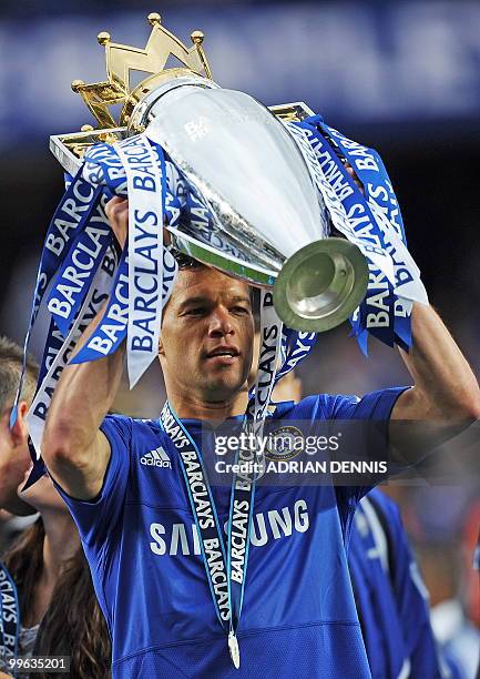 Chelsea's German midfielder Michael Ballack celebrates with the Barclays Premier league trophy after Chelsea win the title with a 8-0 victory over...