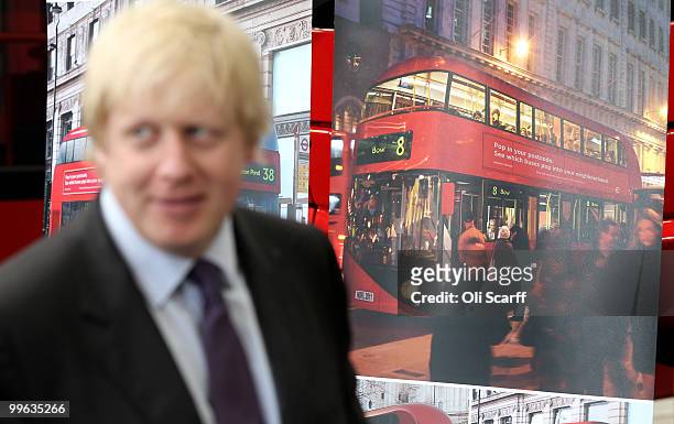 Mayor of London Boris Johnson poses with artists impressions of the design for London's new Routemaster bus on May 17, 2010 in London, England. The...