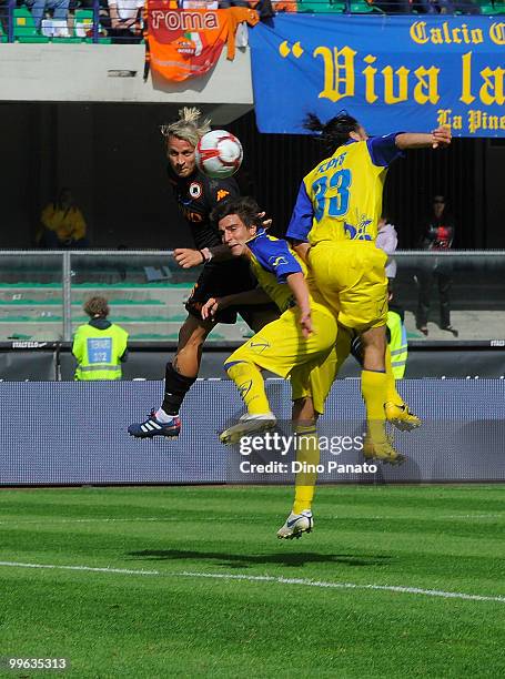 Philippe Mexes competes for a header with Simone Bentivoglio and Mario Yepes of Chievo during the Serie A match between AC Chievo Verona and AS Roma...