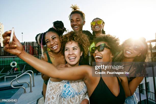 women on rooftop - hot tub party stock pictures, royalty-free photos & images