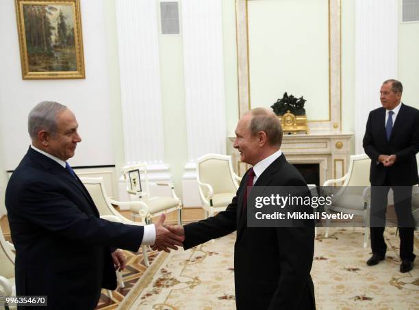 Russian President Vladimir Putin greets Israeli Prime Minister Benjamin Netanyahu during their talks at the Kremlin, in Moscow, Russia, July 2018....