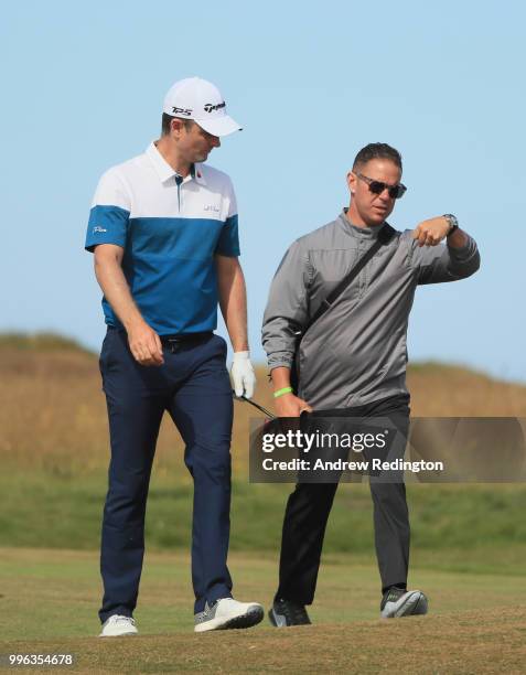 Justin Rose of England chats with his coach Sean Foley during the Pro Am event prior to the start of the Aberdeen Standard Investments Scottish Open...