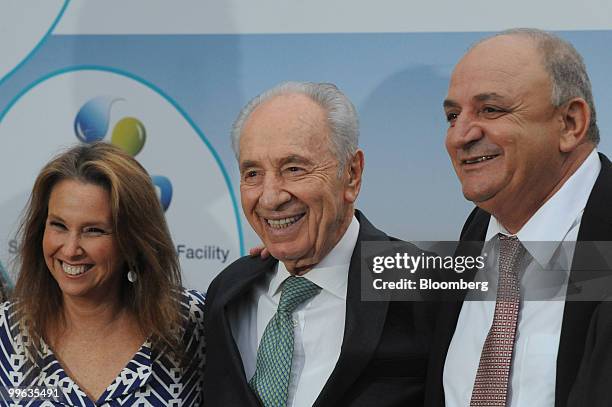 Shari Arison, owner of the Arison Group, Shimon Peres, Israel's president, and Yitzhak Tshuva, head of Delek Group, pose at the opening event of a...